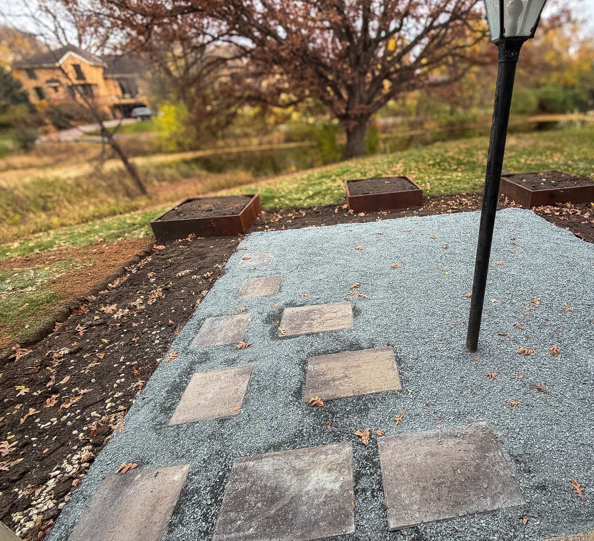 Compacted aggregate base prepared for a permeable landscape surface
