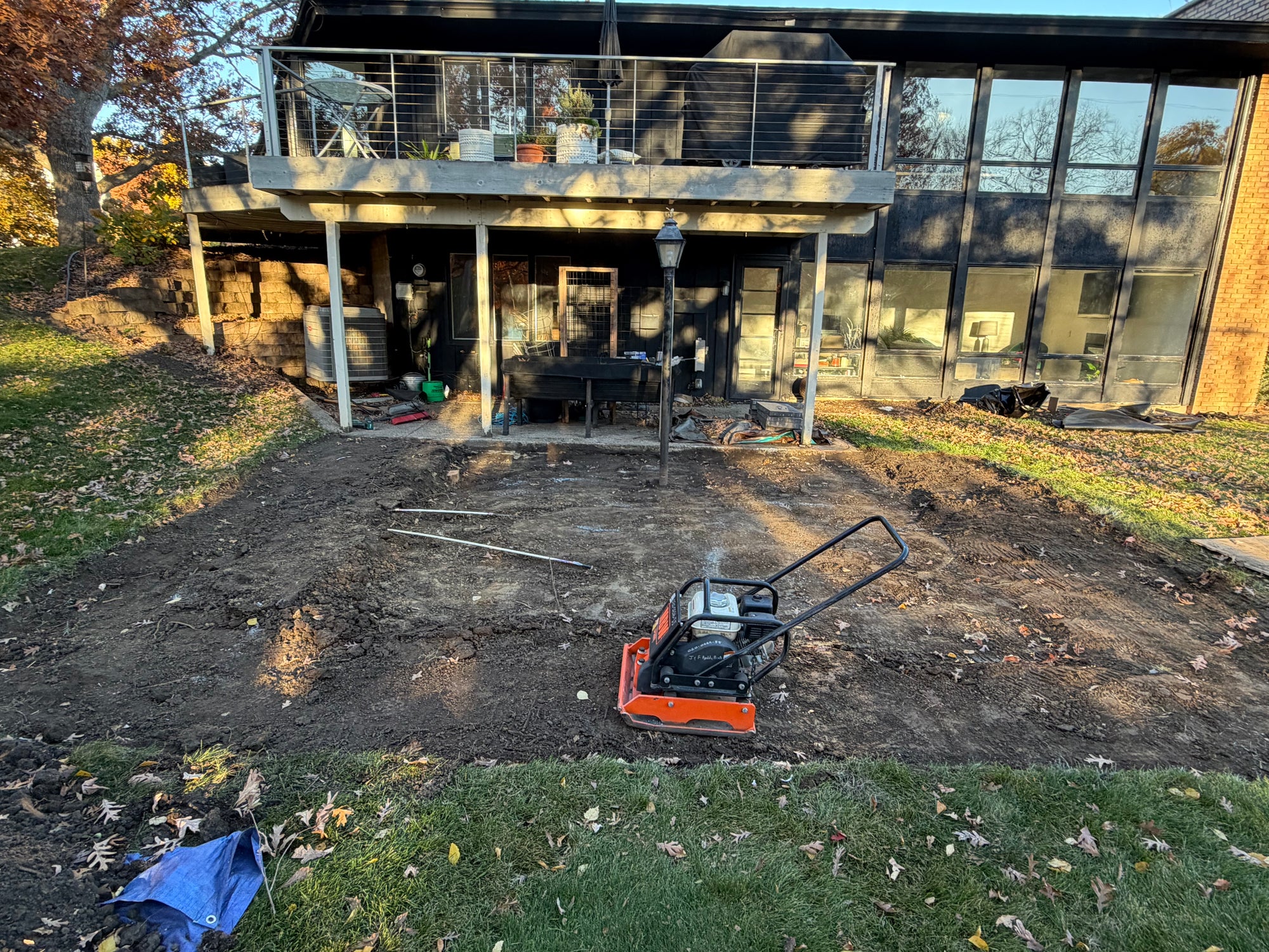 Custom backyard fire pit and patio excavation project by Elzo Landscape LLC in Edina Minnesota