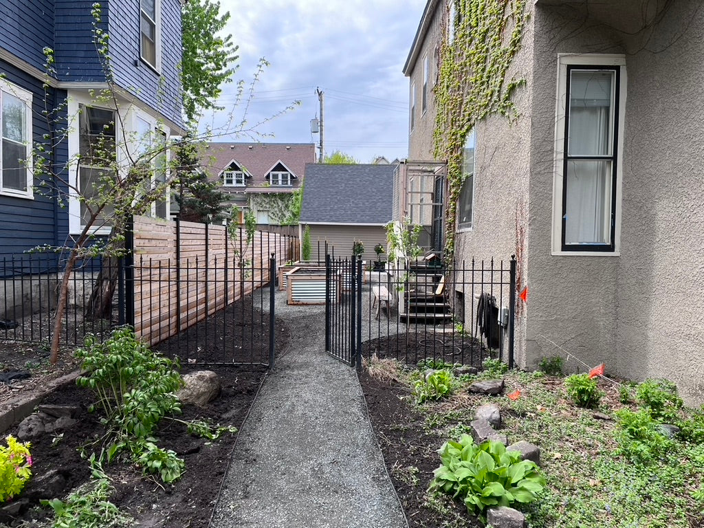Elzo cedar privacy screen and ornamental gate in a Minneapolis garden