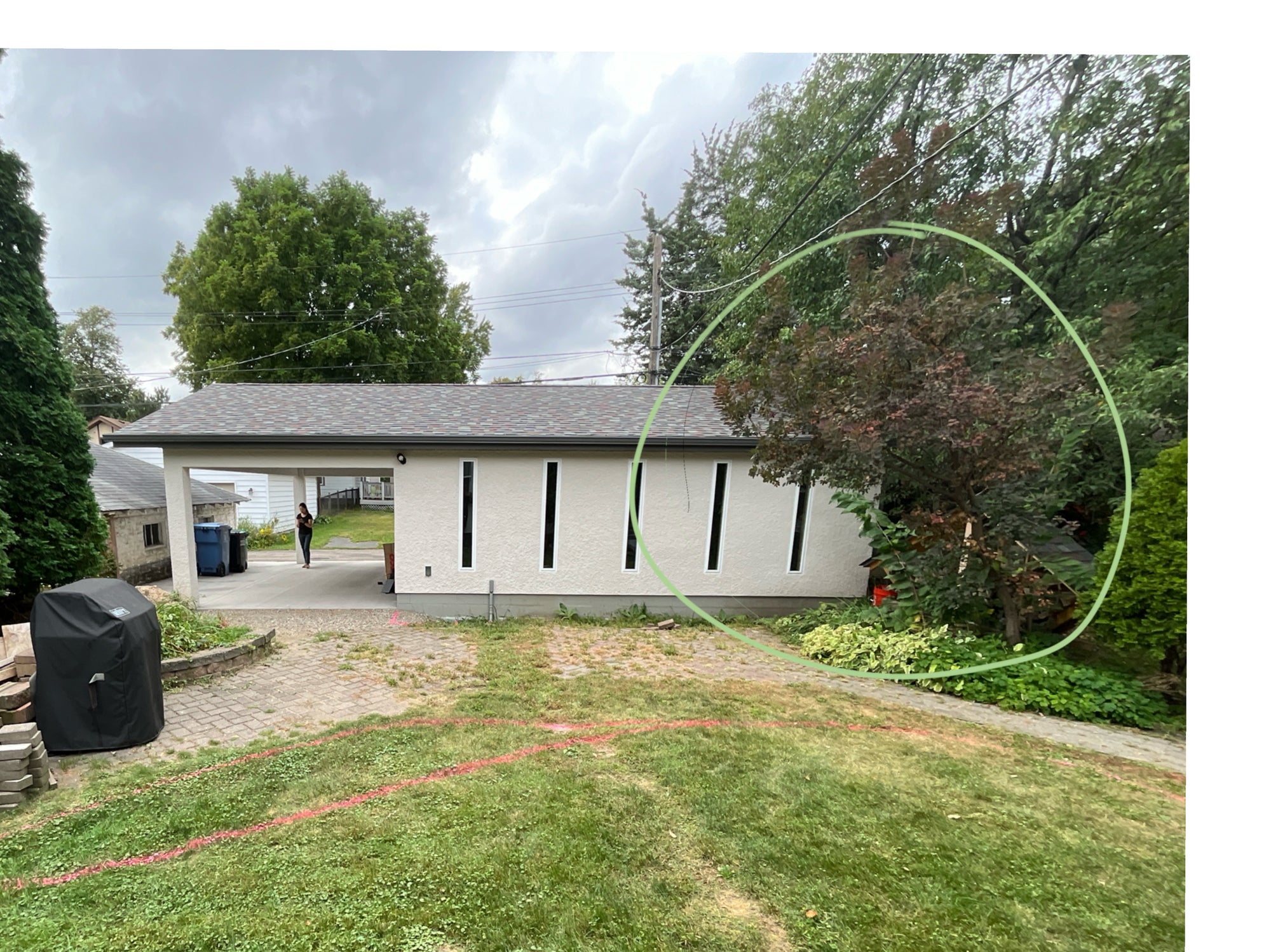 In-progress backyard makeover with paver installation underway
