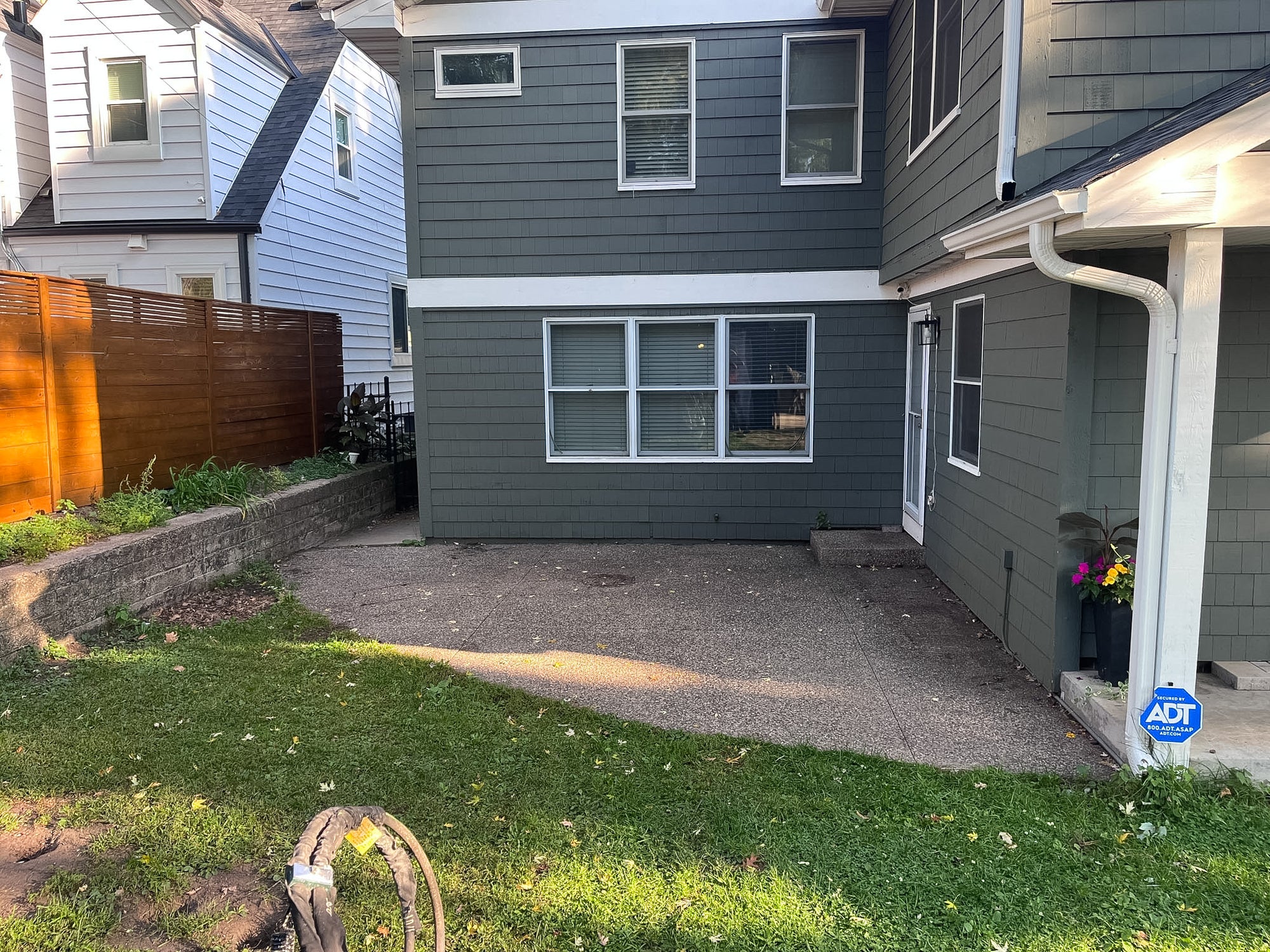 Backyard demolition phase removing old concrete patio and walkways in Cedar Lake Minneapolis