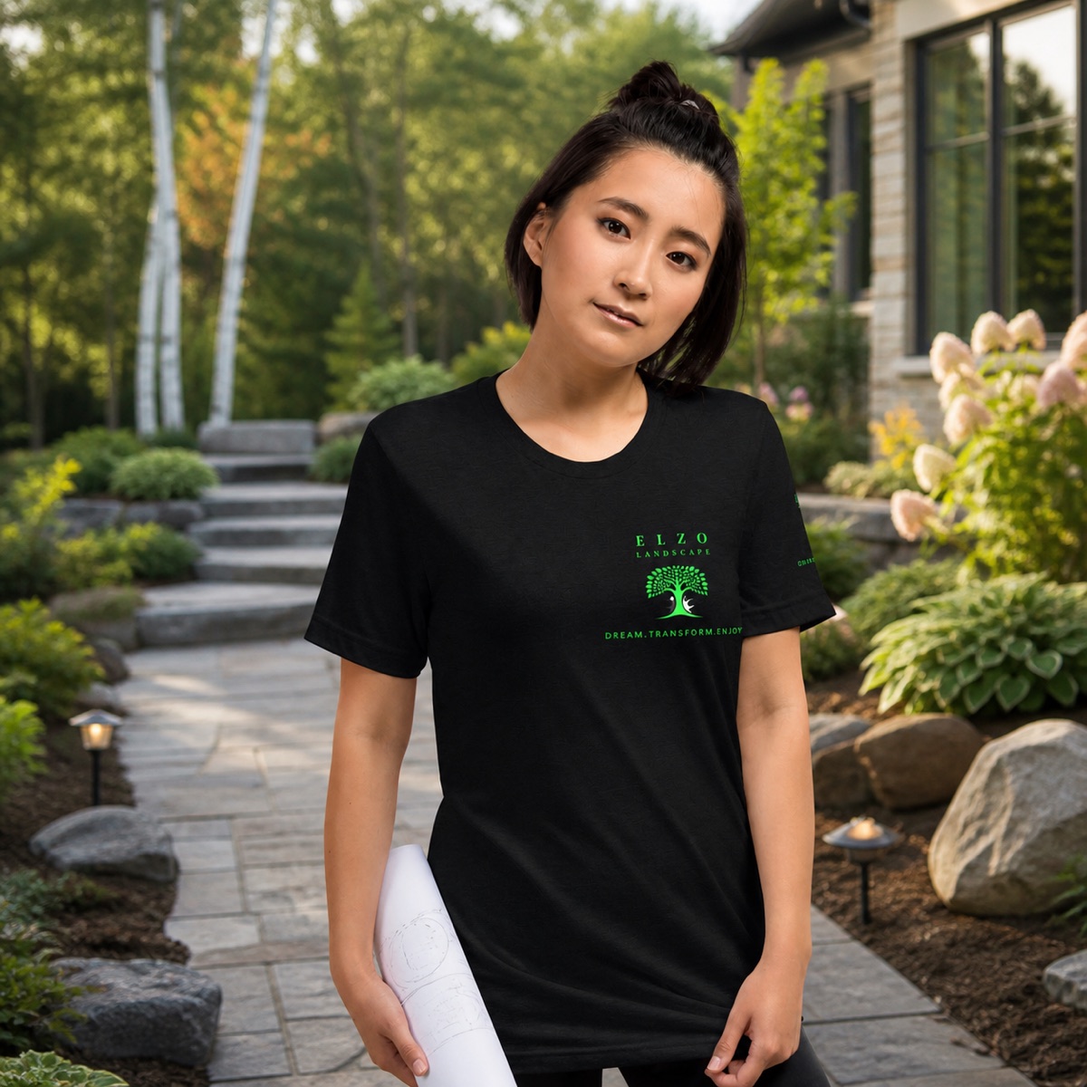 ELZO team member wearing the Landscape Logo Tee in a finished garden